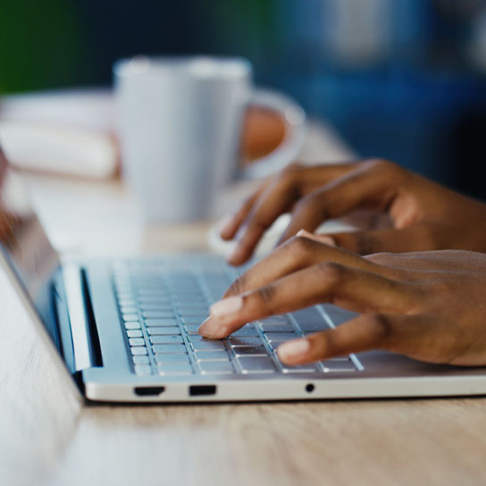Person typing on a laptop